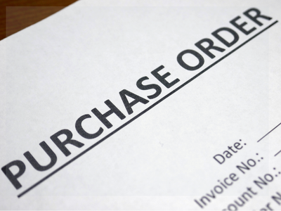A photo of a purchase order form for business purchases.